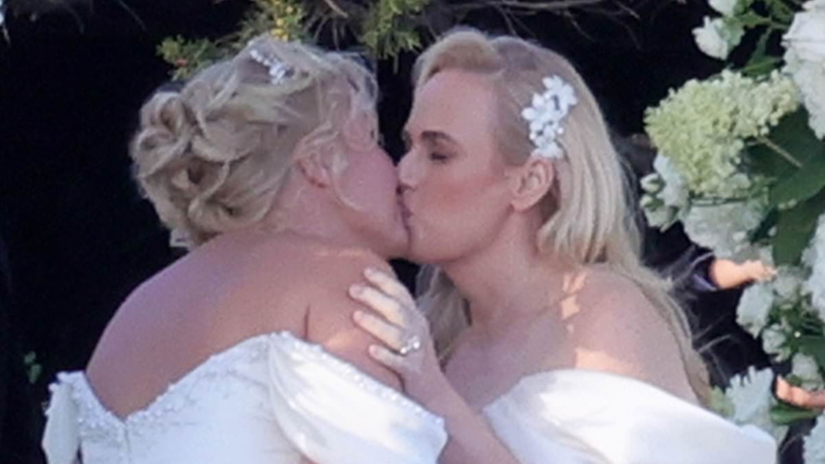 alert-–-rebel-wilson-and-new-wife-ramona-agruma-look-incredible-in-near-identical-wedding-dresses-as-they-share-a-kiss-in-first-images-from-‘super-romantic’-ceremony-in-sardinia