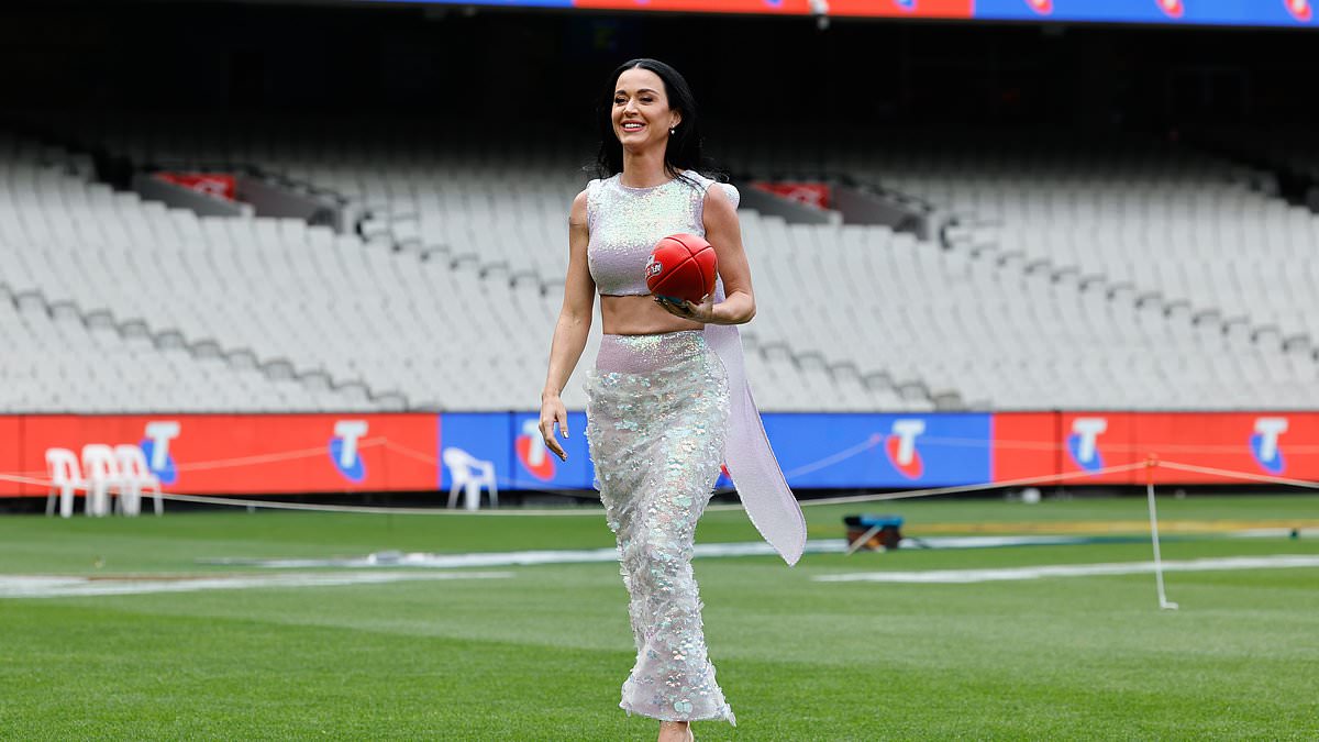 alert-–-katy-perry-is-given-a-very-special-one-of-a-kind-gift-during-her-trip-to-australia-for-afl-grand-final-gig