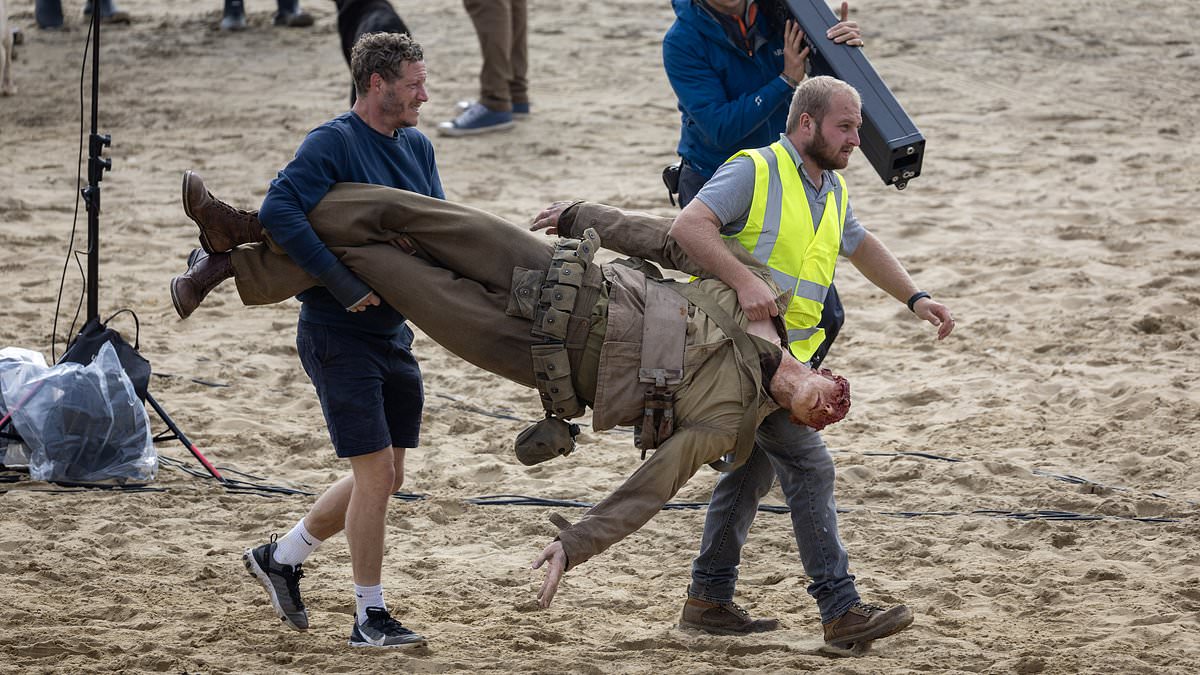 alert-–-cast-of-wwii-drama-pressure-carry-a-partially-decapitated-fake-body-across camber-sands-beach-in-d-day-reenactment-for-upcoming andrew-scott-film