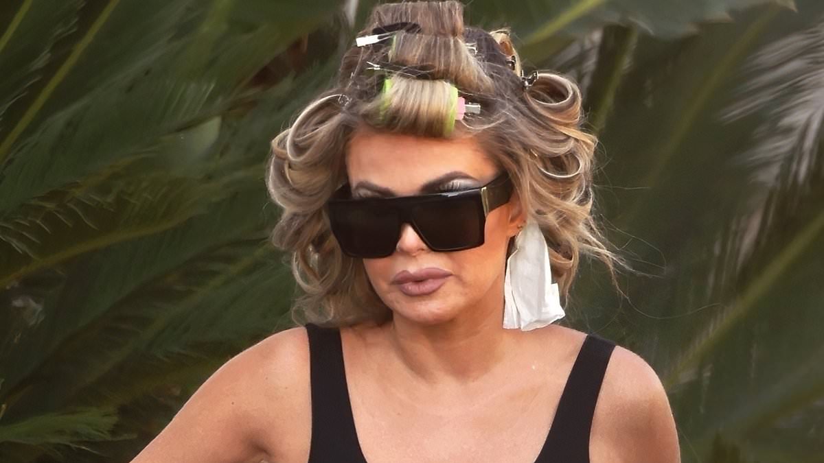 alert-–-carmen-electra-is-downcast-with-curlers-in-hair-as-she-surfaces-after-‘painful’-interview