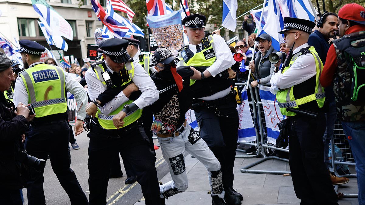 alert-–-met-make-five-arrests-at-pro-palestine-march-in-london-as-protesters-clash-with-police-on-first-anniversary-of-hamas-october-7-attacks-–-while-one-banner-mocks-‘silly-sausage’-keir-starmer