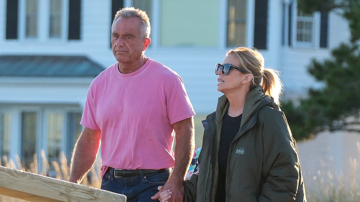 alert-–-rfk-jr.-and-wife-cheryl-hines-are-spotted-hand-in-hand-as-they-return-to-the-kennedy-compound-in-cape-cod-following-death-of-his-mom