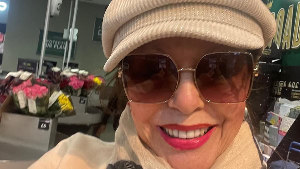 alert-–-dame-joan-collins-oozes-sophistication-as-she-pops-to-m&s-for-a-saturday-grocery-shop-in-a-cream-flat-cap-and-burberry-scarf