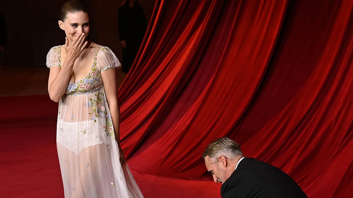 alert-–-joaquin-phoenix’s-wife-rooney-mara-blushes-as-he-fixes-her-dress-on-the-red-carpet-at-academy-museum-gala-in-la-–-after-they-‘secretly-married’