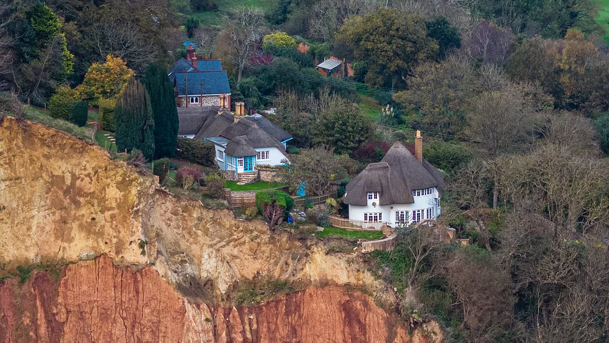 alert-–-on-the-brink!-beautiful-thatched-cottage-in-devon-sits-precariously-close-to-cliff-edge-after-huge-rockfall