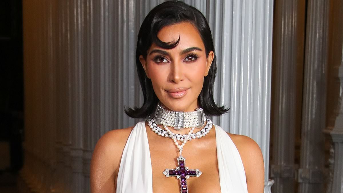 alert-–-kim-kardashian-accessorizes-revealing-gown-with princess-diana’s-amethyst-cross-at-lacma-gala