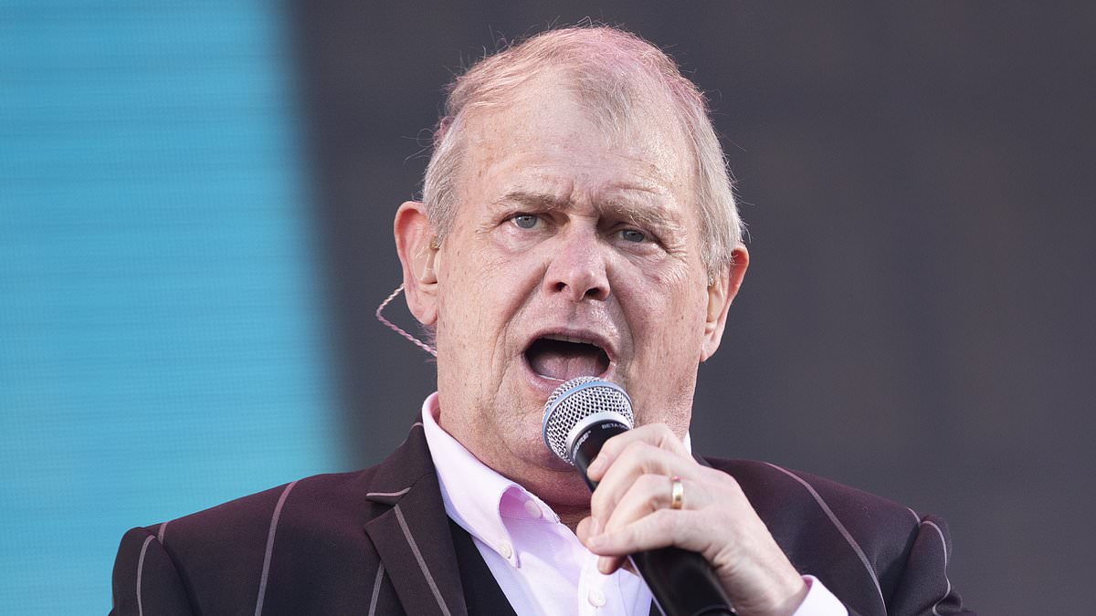 alert-–-john-farnham-seen-in-rare-family-photo-as-he-attends-coldplay-concert-in-melbourne-with-his-wife-jill-and-handsome-sons-after-harrowing-cancer-battle