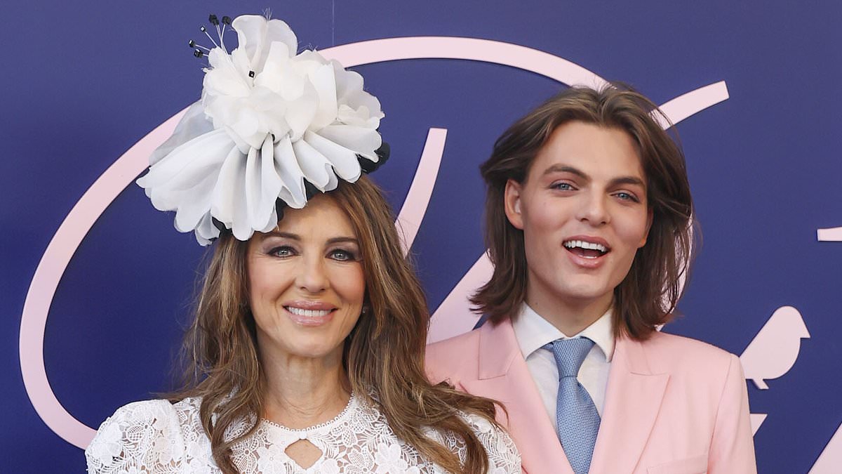 alert-–-elizabeth-hurley-cuts-an-elegant-figure-in-a-white-lace-gown-as-she-joins-her-lookalike-son-damian-at-crown-oaks-day-–-but-will-she-catch-up-with-her-late-ex-shane-warne’s-kids?