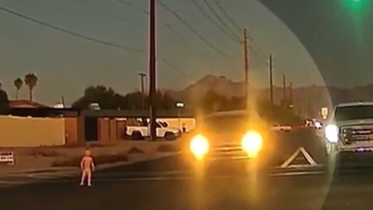 alert-–-heart-stopping-moment-toddler-in-diaper-wanders-into-path-of-oncoming-traffic-at-busy-intersection