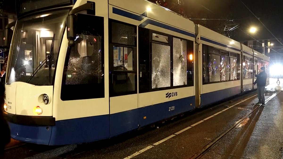 alert-–-shocking-moment-amsterdam-tram-goes-up-in-flames-after-yob-hurls-firework-inside-following-‘jew-hunt’-as-violence-soars-in-city