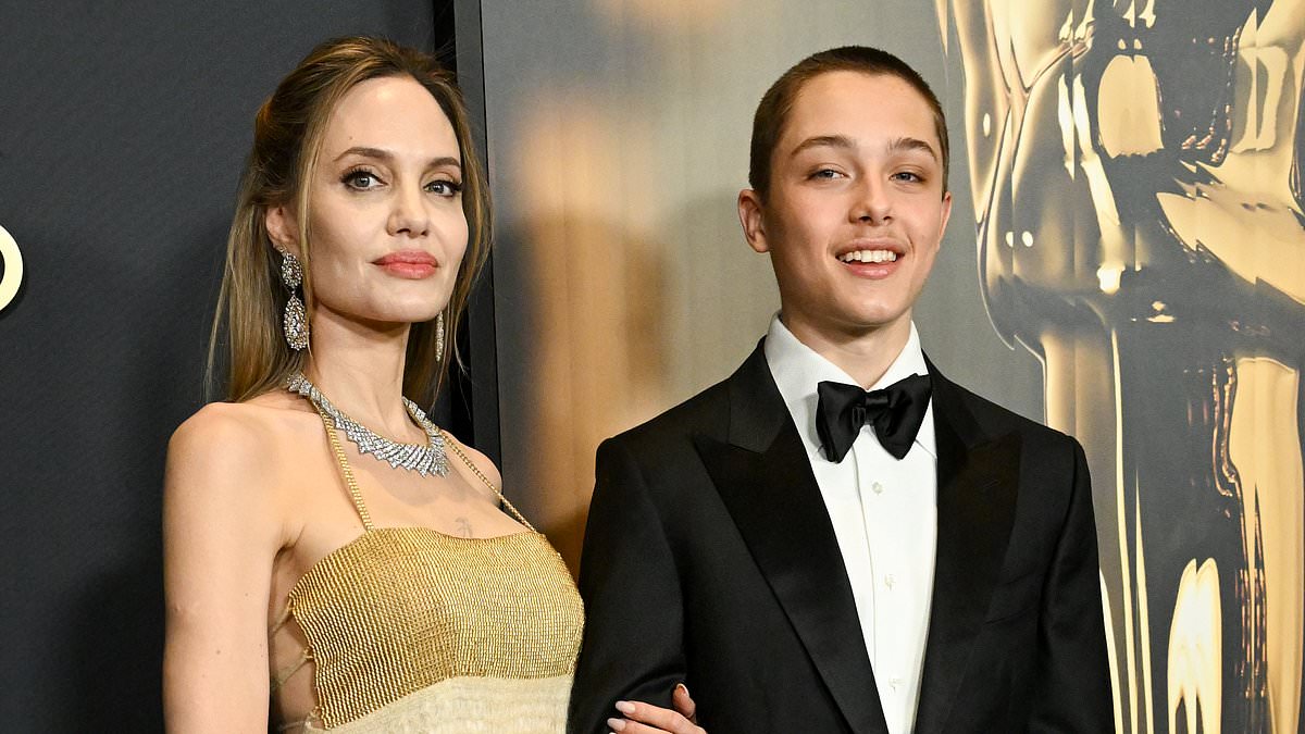 alert-–-angelina-jolie’s-rarely-seen-son-knox-looks-like-a-young-brad-pitt-as-he-towers-over-her-at-governors-awards-2024