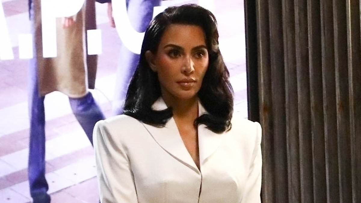 alert-–-kim-kardashian-displays-legs-in-red-fishnet-stockings-and-chic-power-suit-on-set-of-ryan-murphy-show-all’s-fair