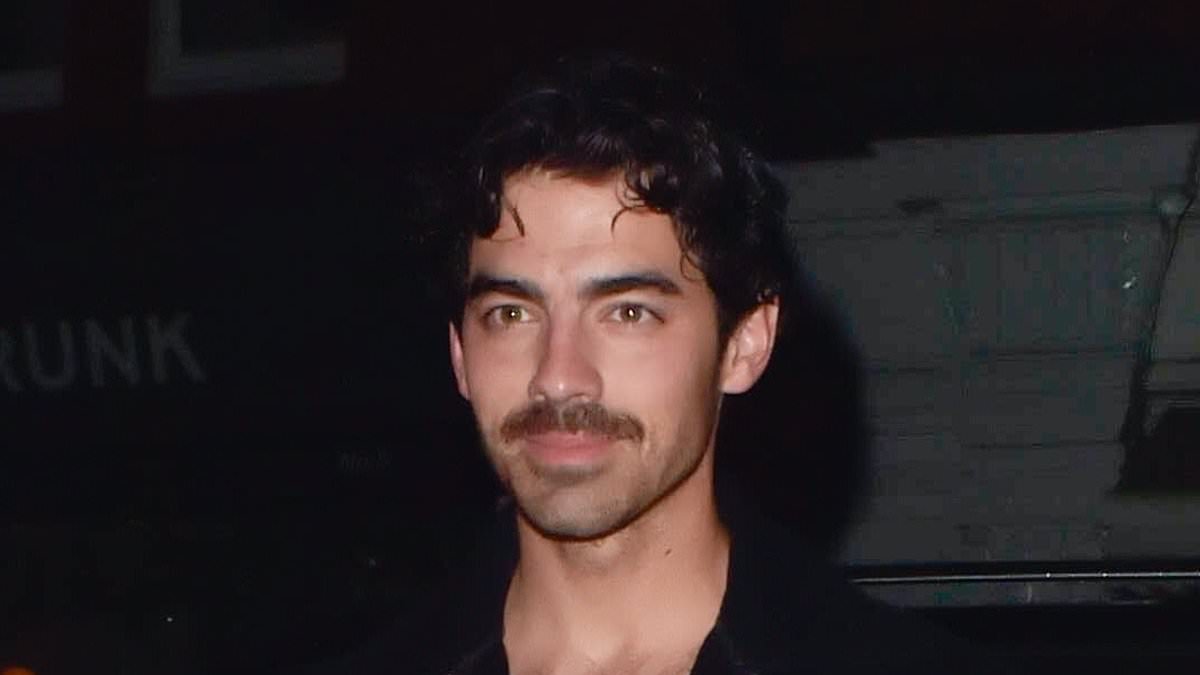 alert-–-joe-jonas-shows-off-his-chest-tattoo-in-low-cut-t-shirt-and-bomber-jacket-during-a-night-out-in-london