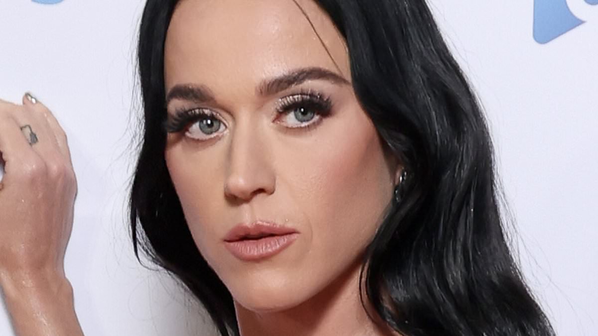 alert-–-braless-katy-perry-wows-in-a-daring-silver-gown-as-she-poses-on-the-capital-jingle-bell-ball-red-carpet-before-taking-to-the-stage-in-a-tiny-crop-top-and-mini-skirt