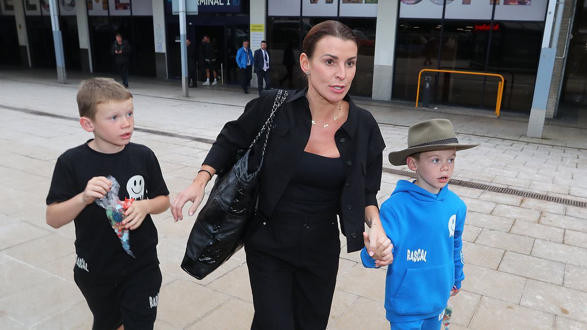 alert-–-i’m-a-celeb-star-coleen-rooney-puts-on-a-brave-face-with-her-sons-as-they-land-in-the-uk-with-no-sign-of-her-husband-wayne-following-his-public-show-of-support