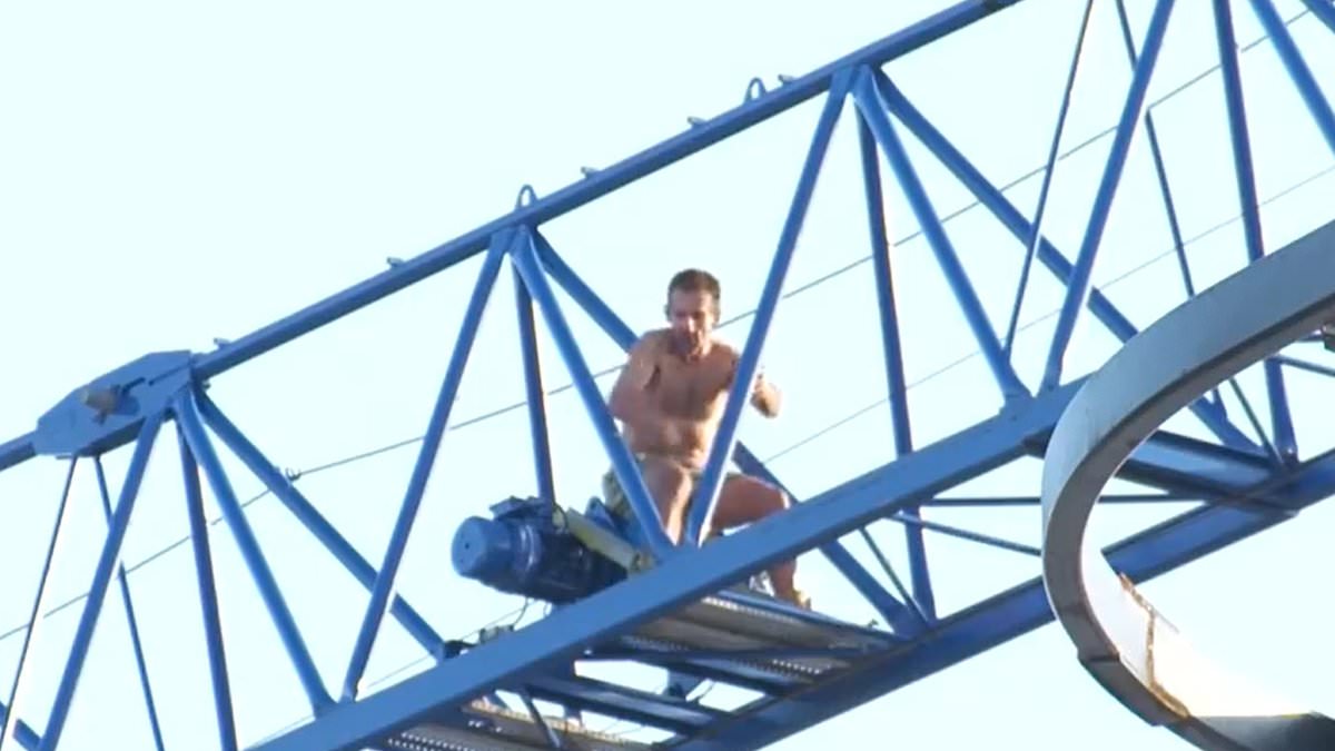 alert-–-man-refuses-to-climb-down-from-a-crane-in-melbourne-after-a-fire-broke-out-at-a-construction-site