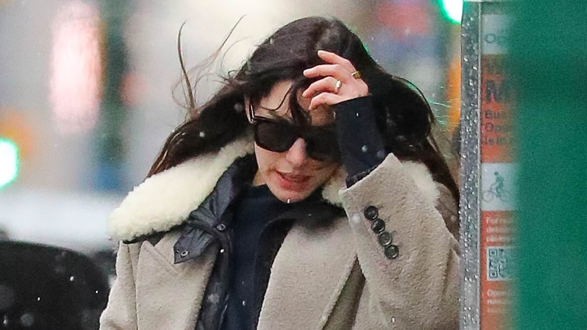 alert-–-anne-hathaway-wraps-up-warm-in-chic-winter-coat-as-she-packs-her-$100k-tesla-ahead-of-leaving-snowy-nyc-for-family-christmas-getaway