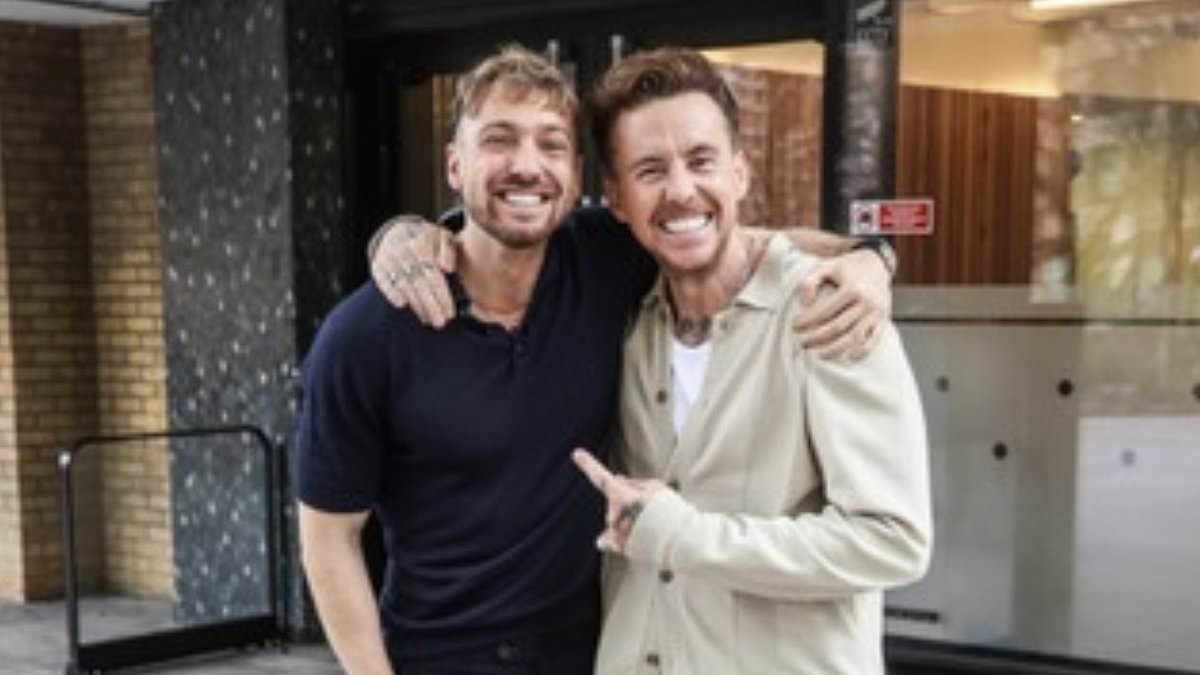 alert-–-i’m-a-celeb-winner-danny-jones-poses-with-former-king-of-the-jungle-sam-thompson-as-they-enjoy-a-surprise-meeting-at-this-morning-studios