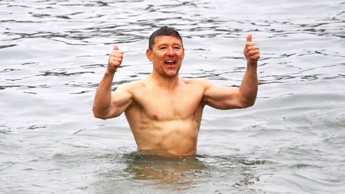 alert-–-ben-shephard,-50,-shows-off-his-impressively-chiselled-abs-as-he-strips-off-to-brave-the-cold-for-christmas-day-dip-in-cornwall