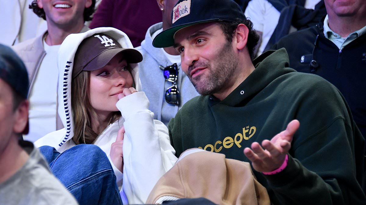 alert-–-olivia-wilde-cuddles-up-to-actor-dane-diliegro-as-she-is-spotted-gazing-at-him-during-a-basketball-game-as-they-spark-romance-rumours-two-years-after-her-split-from-ex-harry-styles