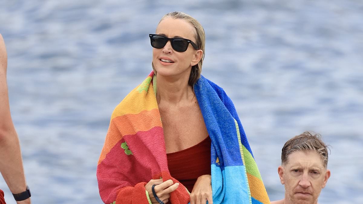 alert-–-jackie-‘o’-henderson-looks-trim-and-terrific-in-red-swimsuit-as-she-gets-a-workout-swimming-laps-at-clovelly