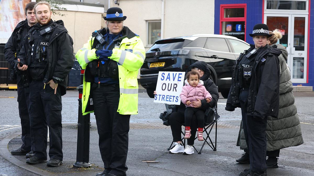 alert-–-furious-residents-blockade-road-and-police-are-called-as-they-try-to-stop-council-imposing-low-traffic-neighbourhood-on-their-street