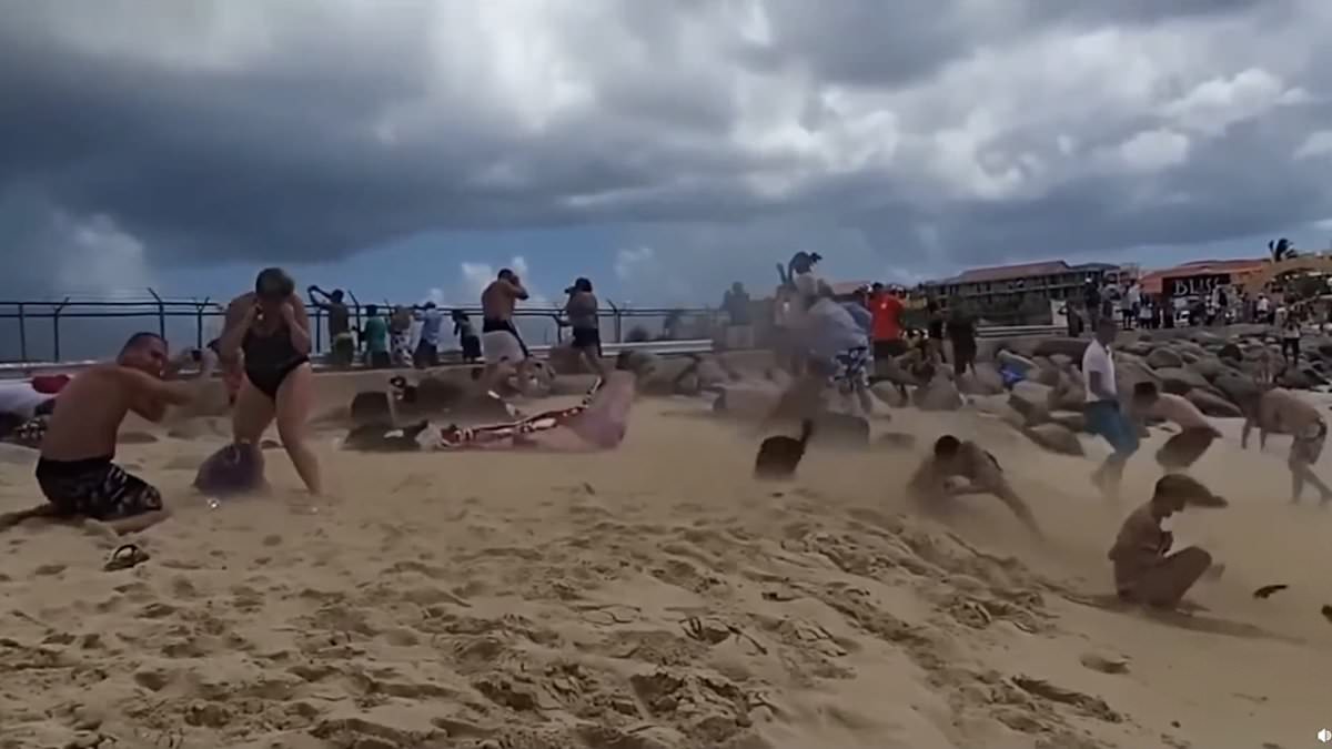 alert-–-get-ready-for-take-off!-moment-tourists-are-blown-into-the-sea-after-standing-behind-jet-to-get-the-perfect-shot-at-‘world’s-scariest-airport’