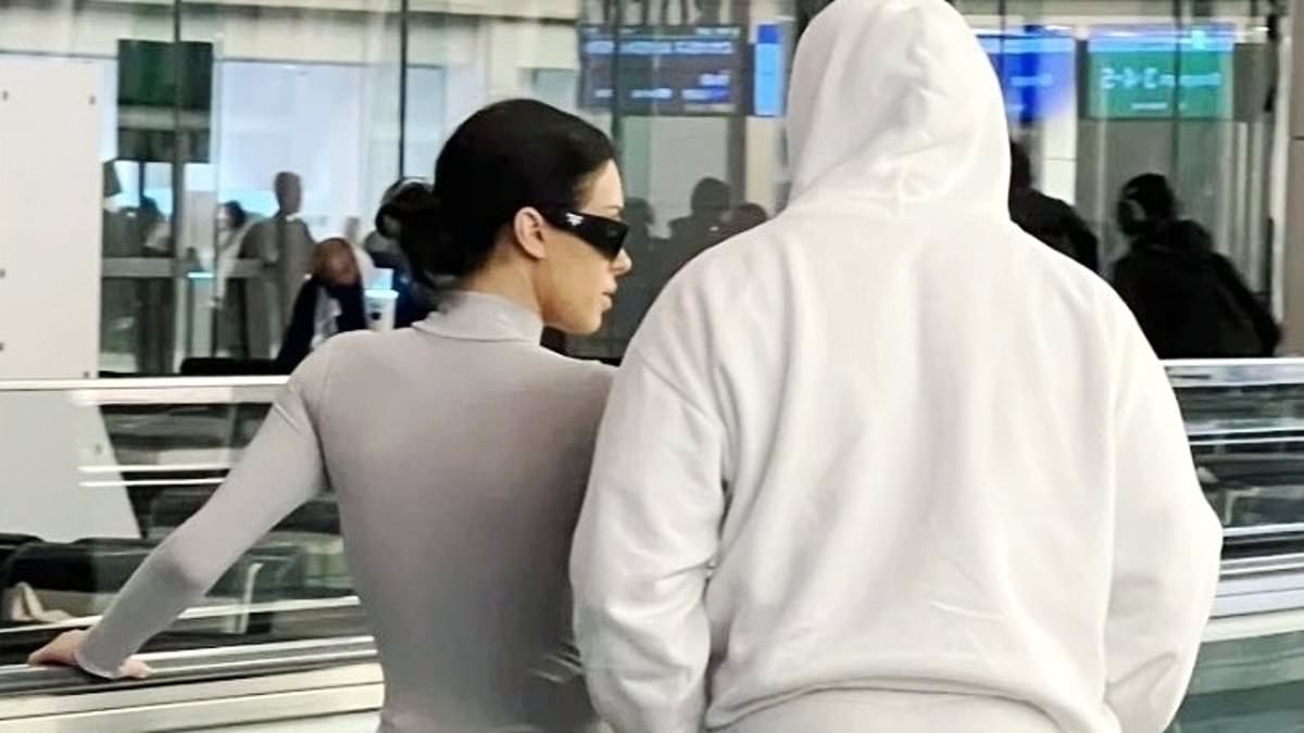 alert-–-kanye-west’s-wife-bianca-censori-wears-sheer-bodysuit-with-tights-as-they-arrive-to-tokyo-airport