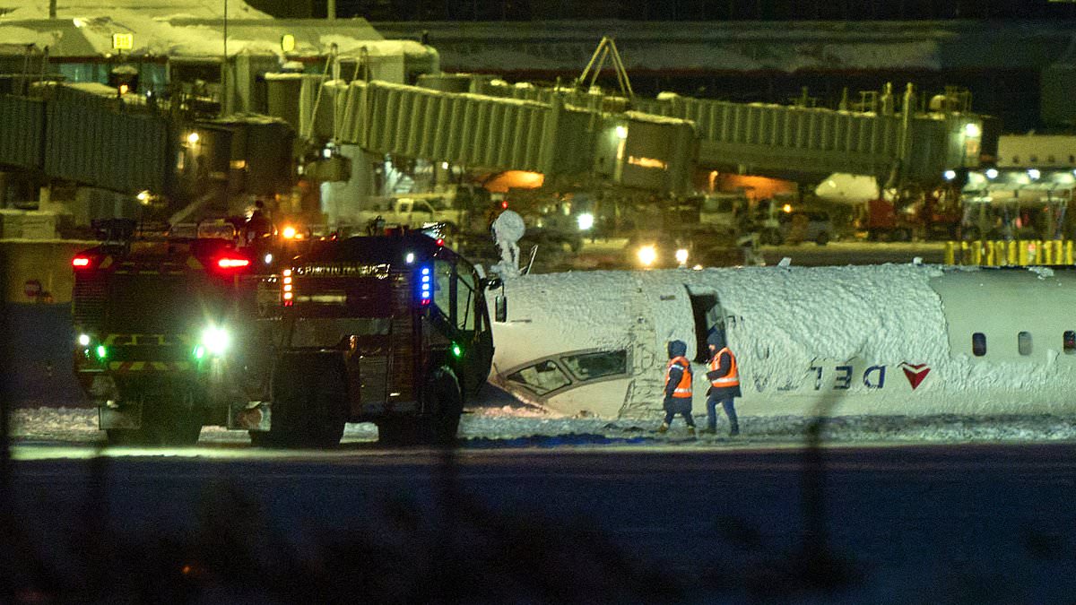 alert-–-incredible-moment-toronto-plane-crash-survivor-films-himself-being-rescued-from-upside-down-delta-aircraft:-live-updates