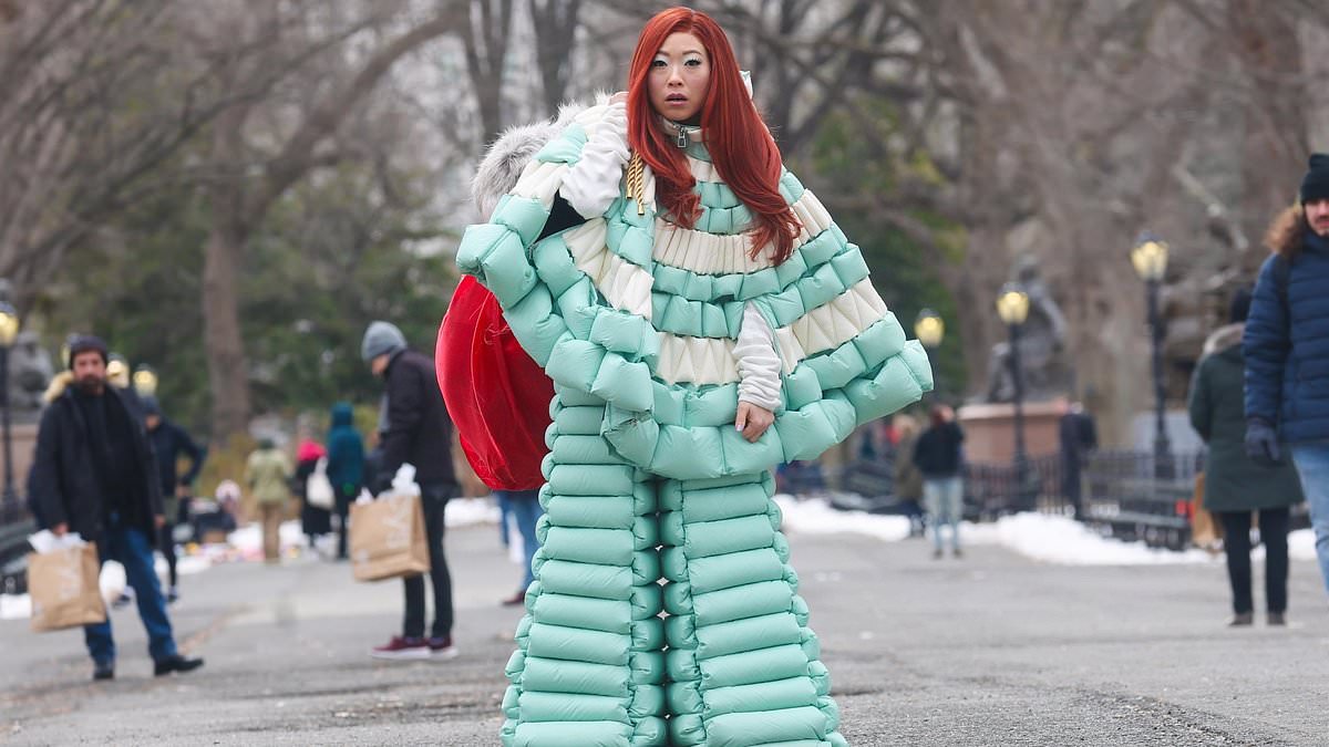 alert-–-awkwafina-debuts-bright-red-hair-as-she-models-a-bizarre-puffy-snow-suit-for-arnold-schwarzenegger-movie