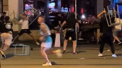 alert-–-aussie-soccer-fans-hurl-metal-chairs-at-one-another-in-mass-street-brawl-in-richmond,-melbourne