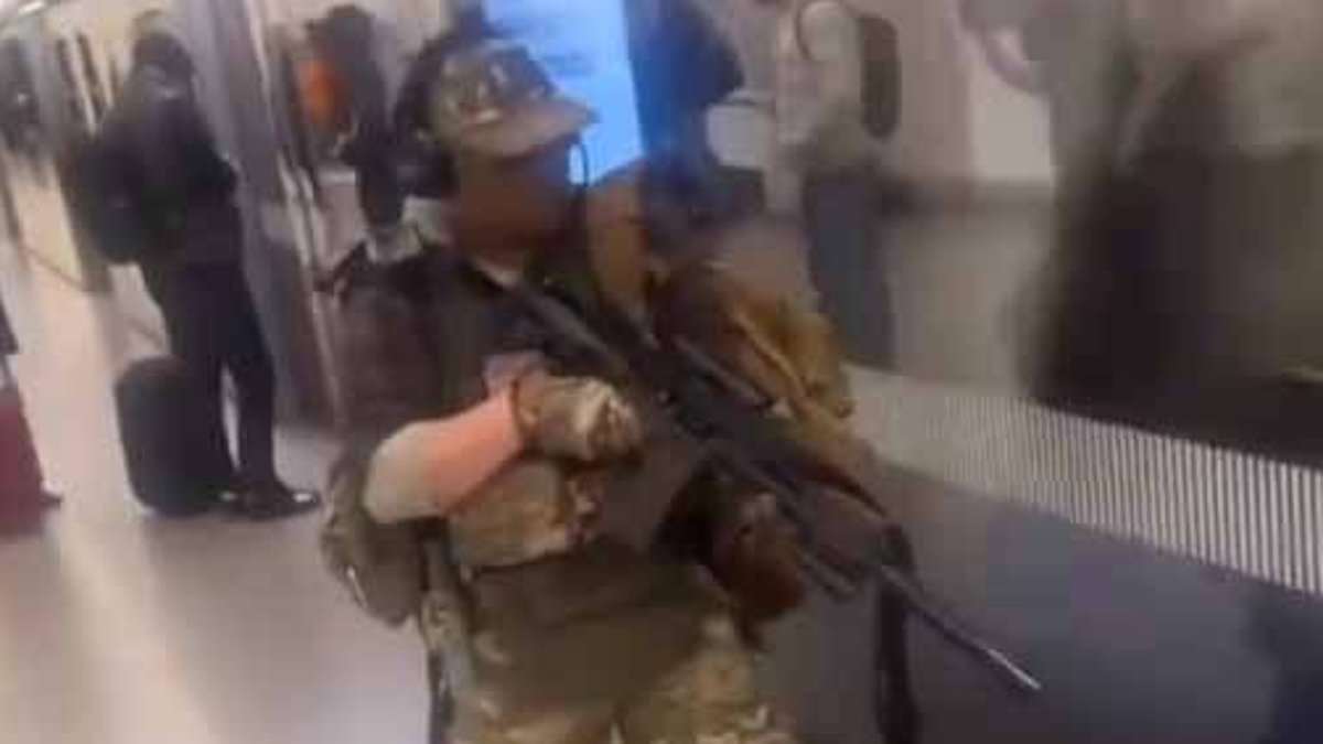 alert-–-terrifying-moment-man-gets-out-‘sniper-rifle’-on-elizabeth-line-tube-platform-wearing-full-camo-gear-–-as-experts-say-‘it’s-a-surefire-way-to-get-yourself-shot’