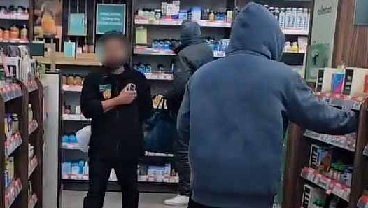 alert-–-moment-two-brazen-shoplifters-casually-grabbed-items-off-shelf-in-holland-&-barrett-before-stuffing-them-into-holdalls-and-walking-out-as-helpless-shop-staff-watched-on