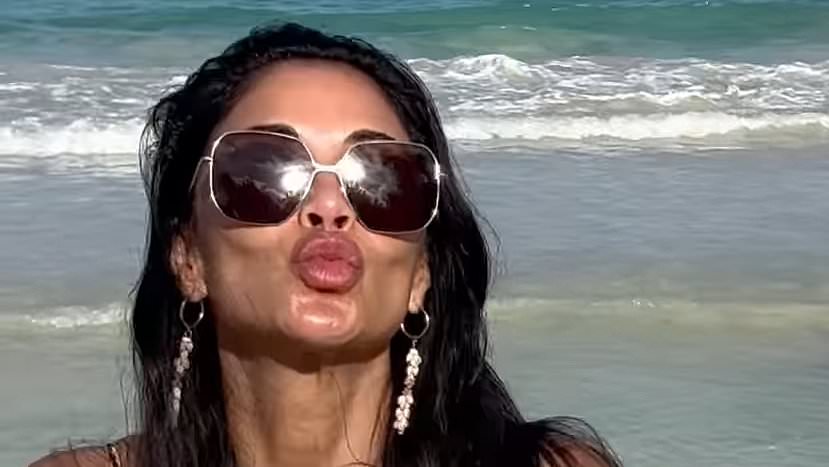 alert-–-nicole-scherzinger,-46,-does-her-best-baywatch-impression-as-she-goes-for-a-jog-on-the-beach-in-leopard-print-bikini