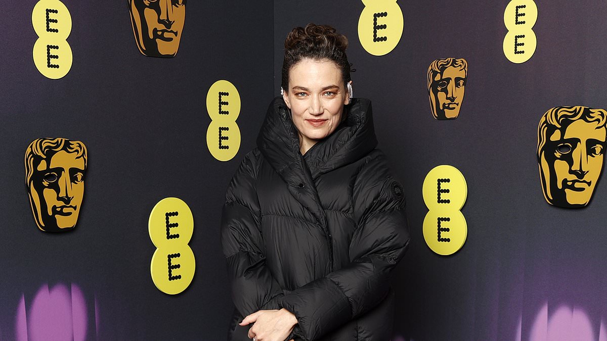 alert-–-the-substance-director-coralie-fargeat-turns-heads-as-she-hits-the-star-studded-red-carpet-in-a-black-puffer-coat-at-the-2025-baftas