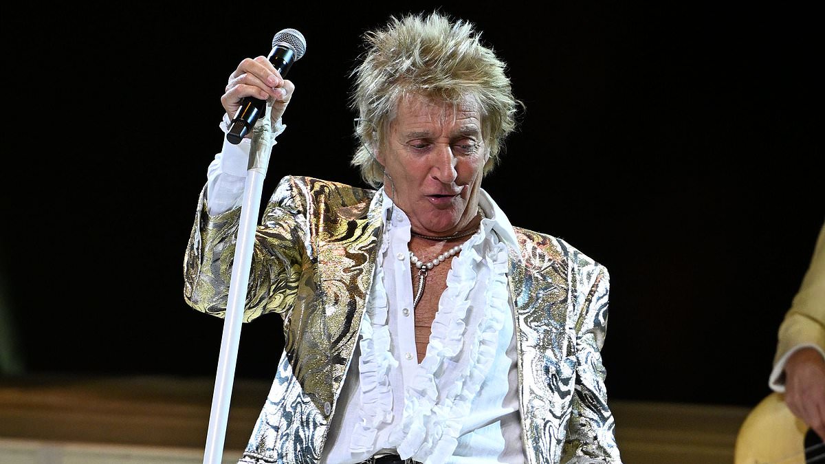 alert-–-sir-rod-stewart,-80,-bares-his-chest-in-a-ruffled-white-shirt-as-he-lets-loose-on-stage-during-his-one-last-time-tour-in-florida