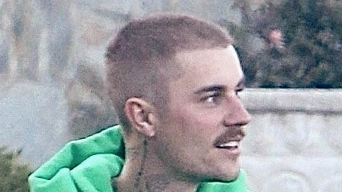 alert-–-justin-bieber-flashes-a-smile-as-he-makes-rare-move-of-taking-his-hat-off-following-hair-transplant-rumors