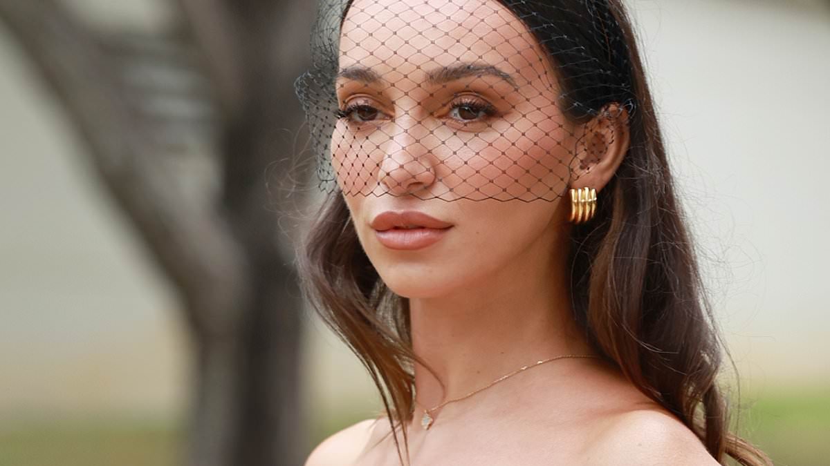 alert-–-bachelor-star-bella-veralis-steals-the-spotlight-in-red-gown-with-her-designer-handbag-as-she-leads-arrivals-at-golden-slipper-day-in-sydney