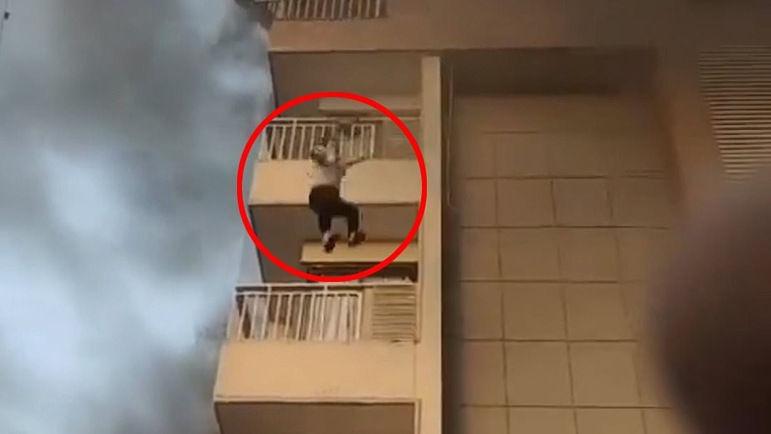 alert-–-shocking-moment-woman-jumps-from-fifth-floor-of-burning-apartment-block-and-survives 
