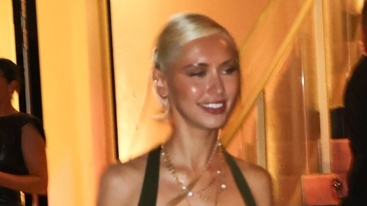 alert-–-iris-law-puts-on-a-leggy-display-in-a-dark-green-mini-dress-and-gold-heels-as-she-joins-a-pal-at-the-david-yurman-miami-store-opening-after-party
