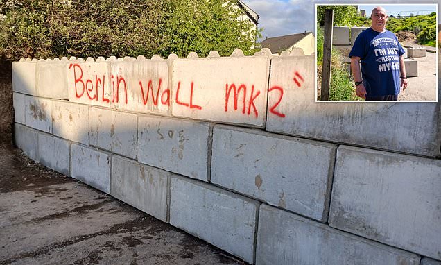 alert-–-the-great-wall-of-devon!-inside-landowner’s-battle-with-neighbours-and-council-after-building-six-foot-concrete-barrier-to-block-locals