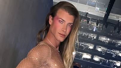 alert-–-christian-wilkins-leaves-very-little-to-the-imagination-as-he-slips-into-a-completely-see-through-dress-at-kylie-minogue-concert