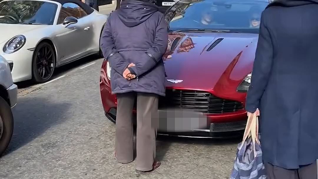alert-–-moment-furious-woman-walks-into-middle-of-the-road-in-mayfair-to-confront-aston-martin-driver-for-revving-too-loudly