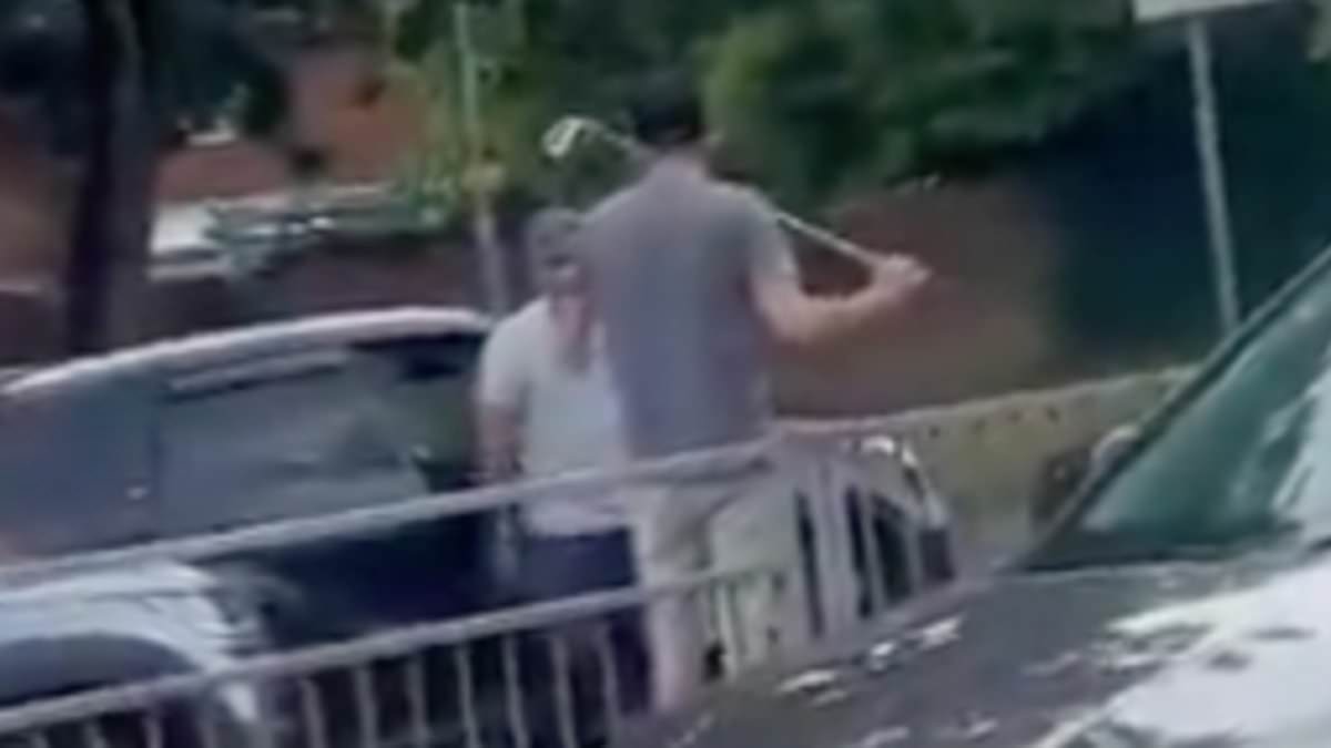 alert-–-moment-angry-driver-gets-in-road-rage-row-with-rival-motorist-while-armed-with-golf-club