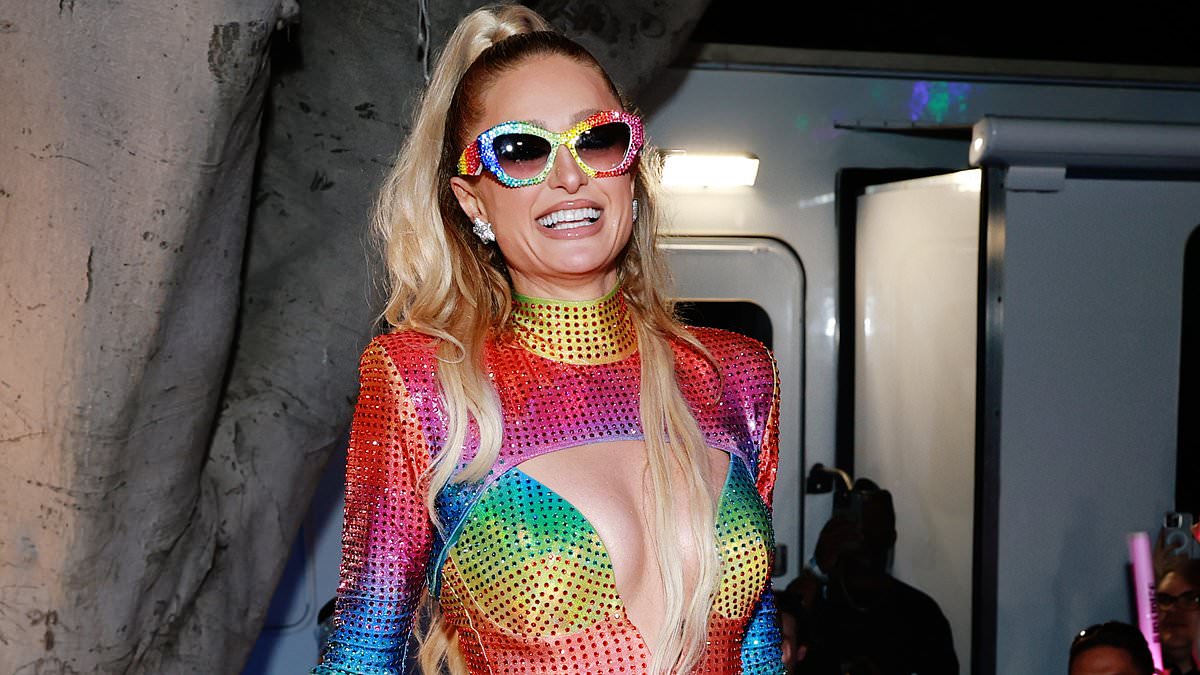 alert-–-paris-hilton,-44,-almost-spills-out-of-cut-out-pride-minidress-as-she-glows-during-performance