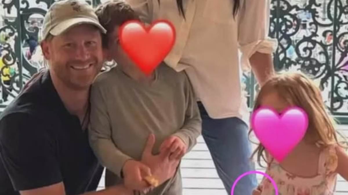 alert-–-prince-harry-and-meghan-markle’s-disneyland-family-photo-sparks-wild-conspiracy-theories:-royal-fans-claim-children-were-added-with-ai-and-a-mystery-‘disembodied’-hand-is-holding-up-lilibet