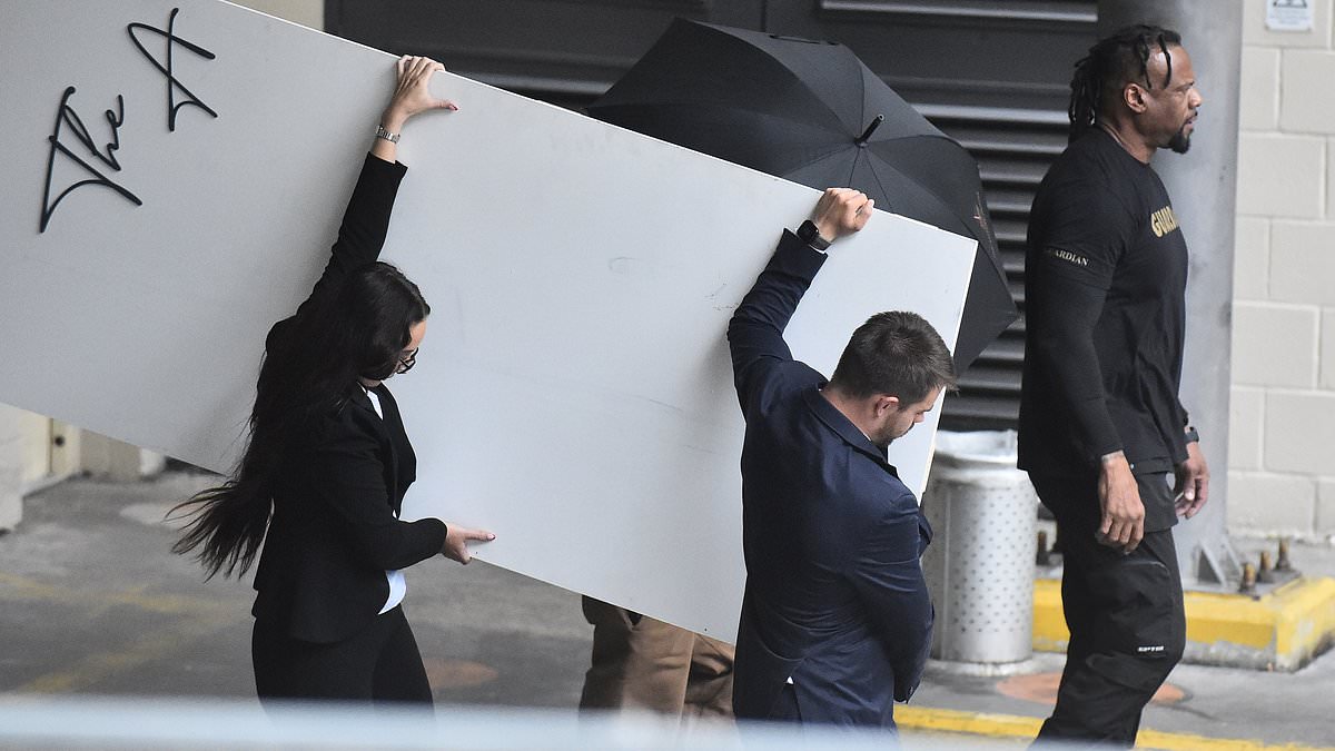 alert-–-chris-brown-tries-desperately-to-hide-his-face-as-he-returns-for-show-in-manchester-a-month-after-being-arrested-in-the-city-over-alleged-nightclub-bottle-attack