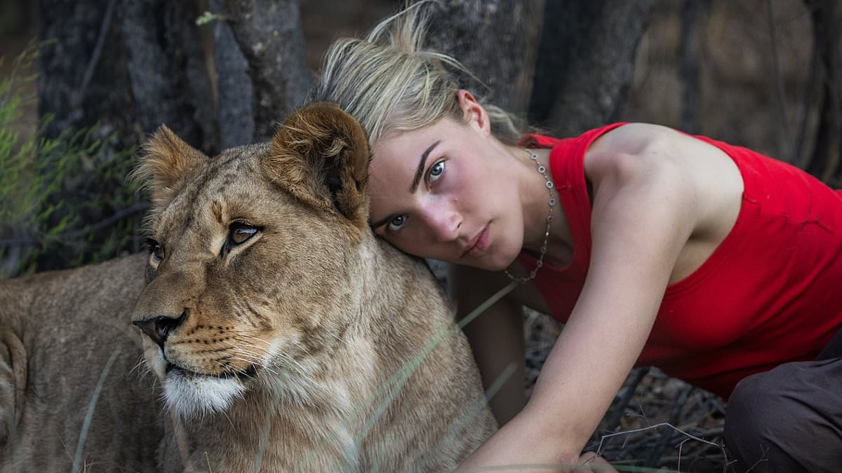 alert-–-nepo-baby,-21,-is-spitting-image-of-’90s-tv-star-mother-as-she-cuddles-lion-in-africa-–-but-can-you-guess-who-her-famous-parent-is?