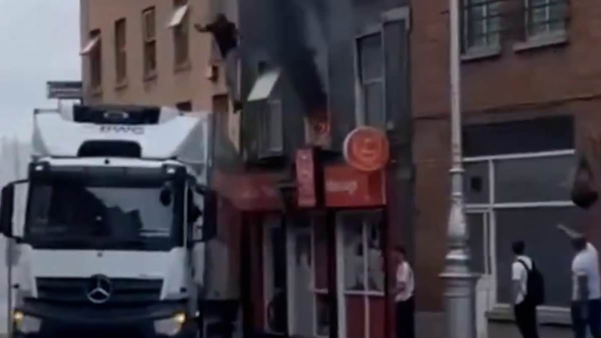 alert-–-incredible-moment-hero-lorry-driver-saves-person-from-burning-building-as-smoke-pours-from-windows
