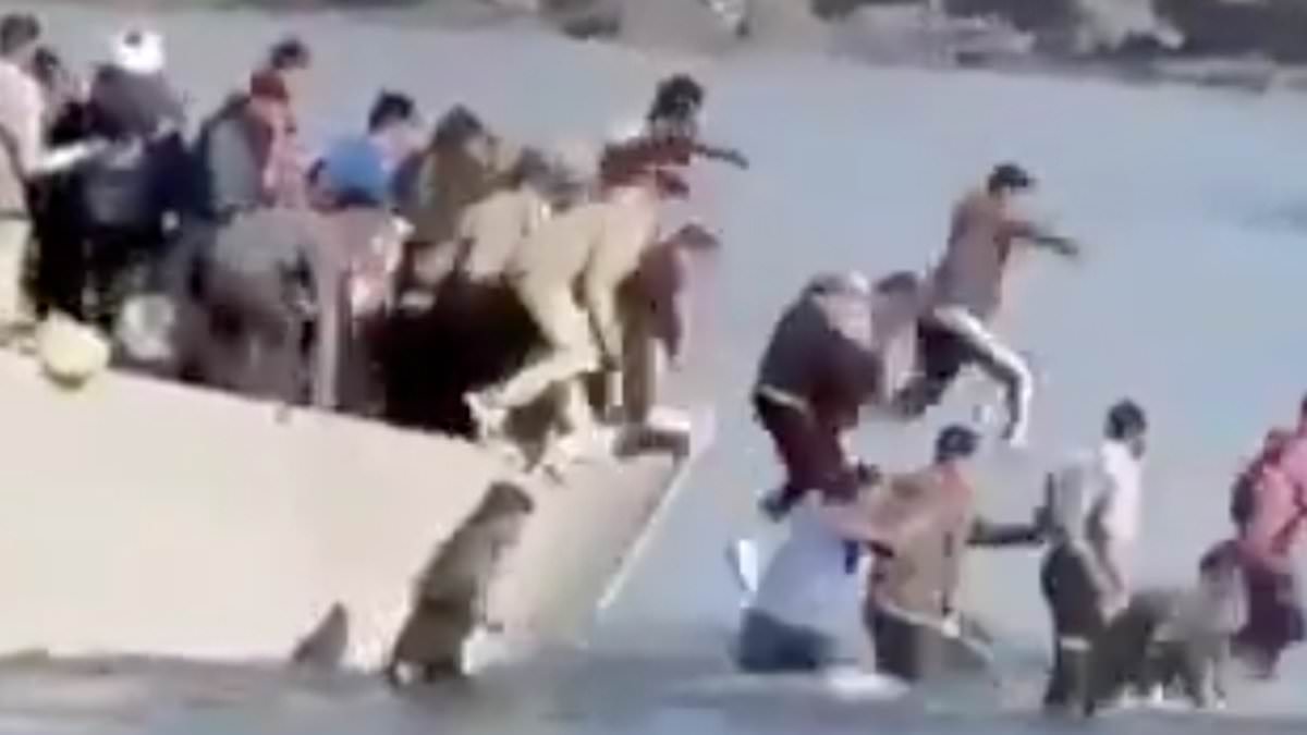 alert-–-moment-stunned-tourists-watch-on-as-dozens-of-migrants-leap-off-a-boat-and-run-up-popular-beach-on-greek-holiday-island